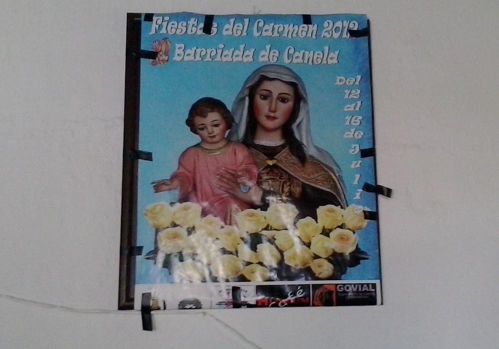 Cartel anunciador de las fiestas de la Virgen del Carmen en la Barriada de Canela